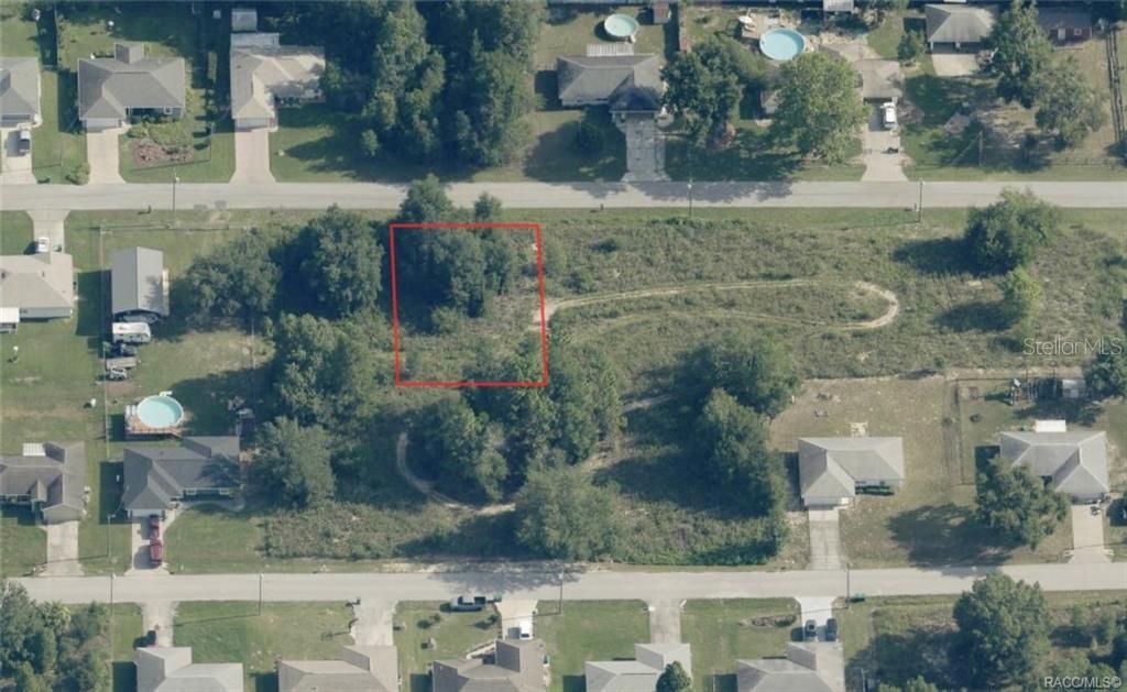 An aerial view shows a vacant, wooded residential lot outlined in red between two streets — 0 E ALLENDALE STREET, INVERNESS, FL