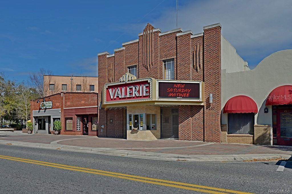 A brick building with a marquee sign for the Valerie Theatre stands on a street — 0 E ALLENDALE STREET, INVERNESS, FL