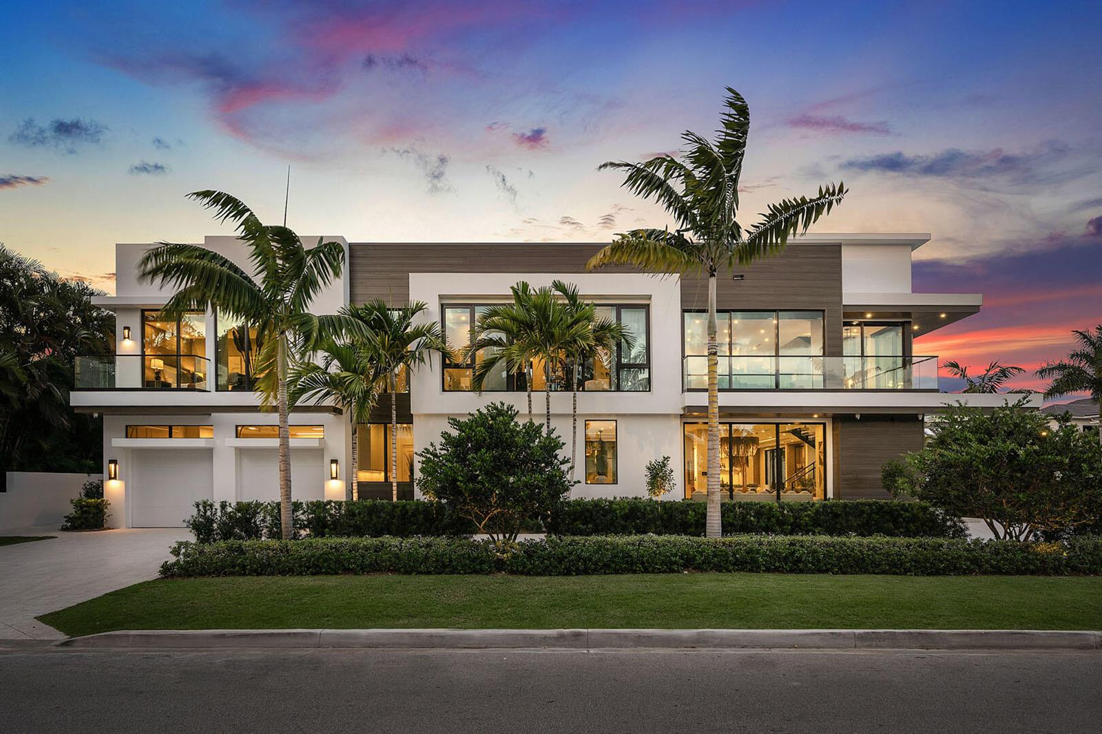 A modern two-story house with a flat roof, glass balconies, and palm trees at sunset — 303 S Maya Palm Drive, Boca Raton FL 33432, BOCA RATON, FL