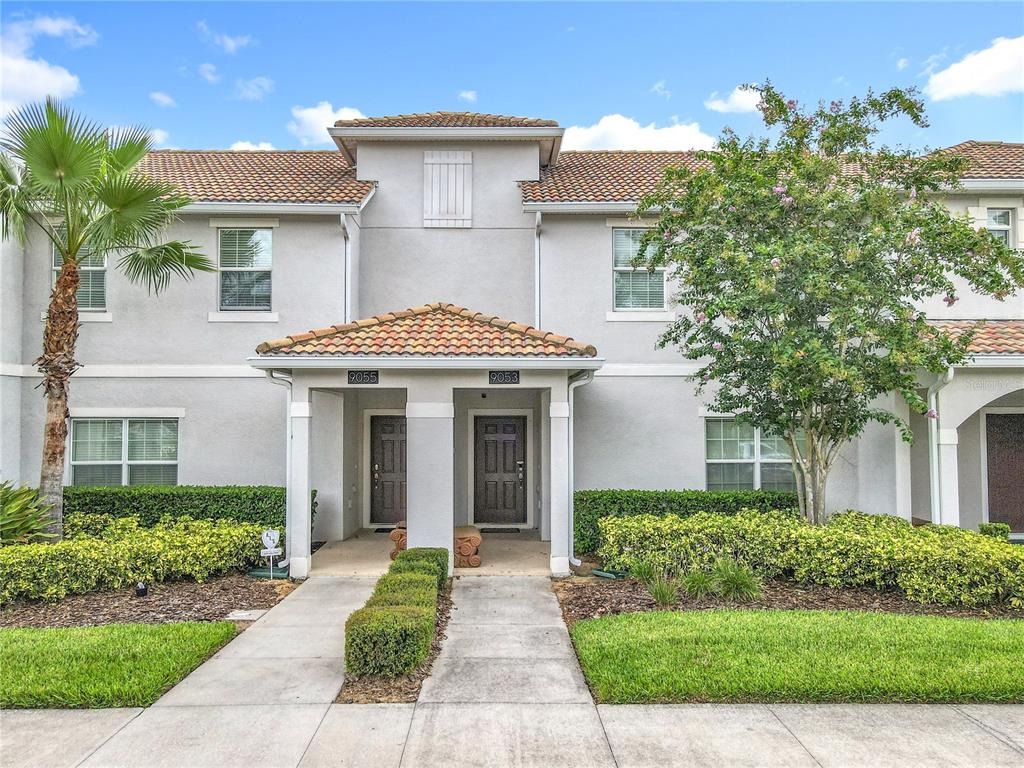 A dining room features a concrete table, wooden chairs, tile flooring, and a sliding glass door — 9053 DOGLEG DRIVE, DAVENPORT, FL