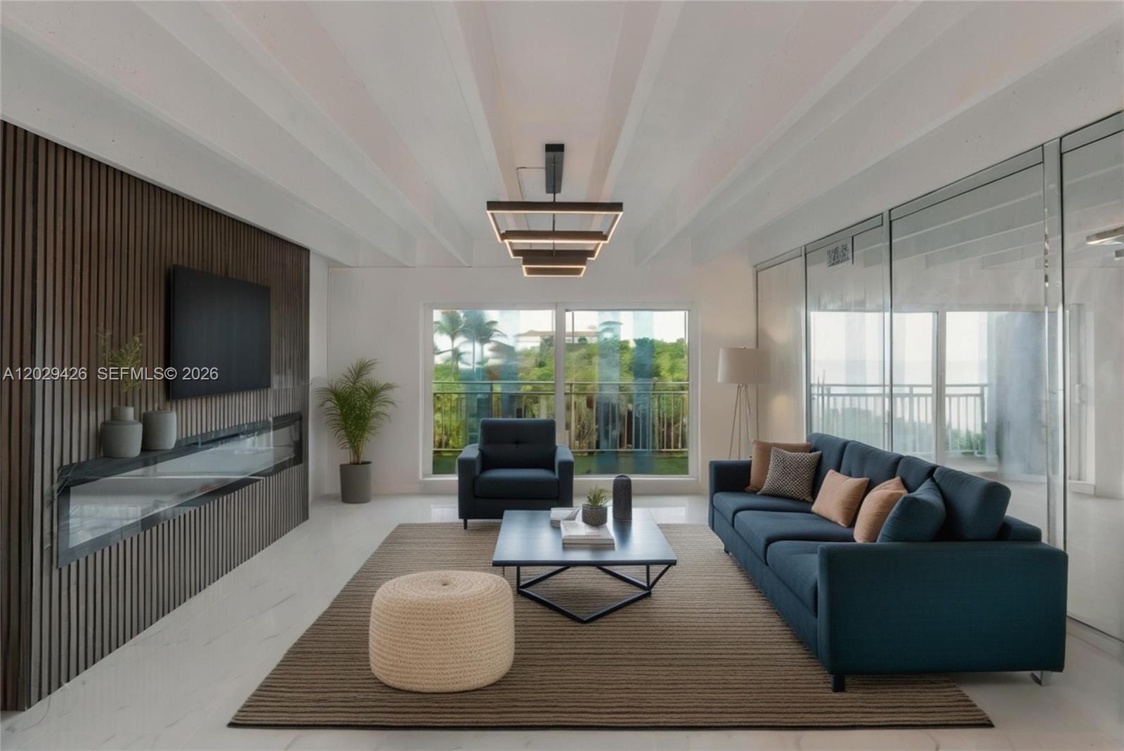A modern living room features a slatted wood wall, a blue sofa, and floor-to-ceiling windows — 4500 S Ocean Blvd # 405, Lantana FL 33480, LANTANA, FL