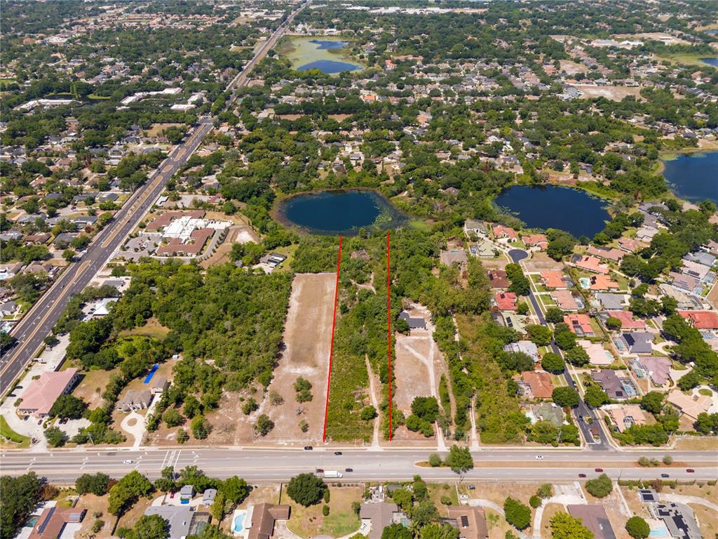 An aerial view shows two adjacent vacant lots outlined in red along a paved road — 4512 S HIAWASSEE ROAD, ORLANDO, FL