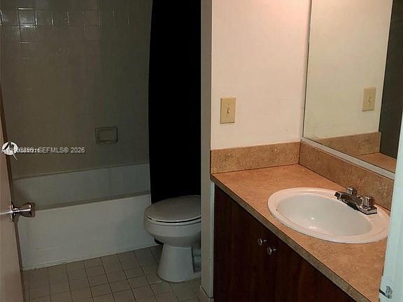 A bathroom features a vanity with a sink, a toilet, and a shower-tub combination — 7235 NW 179th St # 103, Hialeah FL 33015, HIALEAH, FL