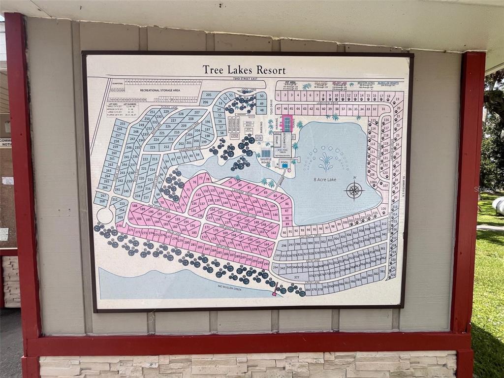 This is a map of the Tree Lakes Resort displayed on a wooden sign — 2215 73RD STREET E UNIT 348, PALMETTO, FL