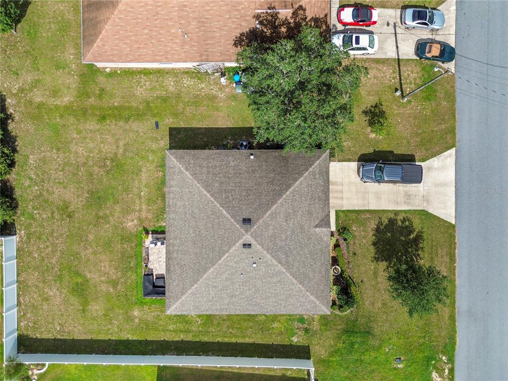 An aerial view shows a single-story house with a hip roof, driveway, and backyard — 3697 SW 128TH PLACE, OCALA, FL