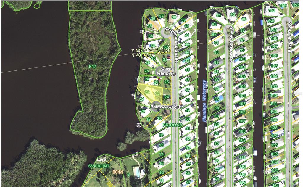 This is a satellite map showing residential lots and waterways in a coastal neighborhood — 6604 PALMWOOD COURT, PUNTA GORDA, FL
