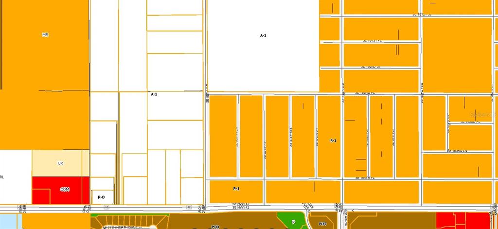 This is an aerial map showing a rectangular parcel of land outlined in red — TBD SE 80TH AVENUE, SUMMERFIELD, FL