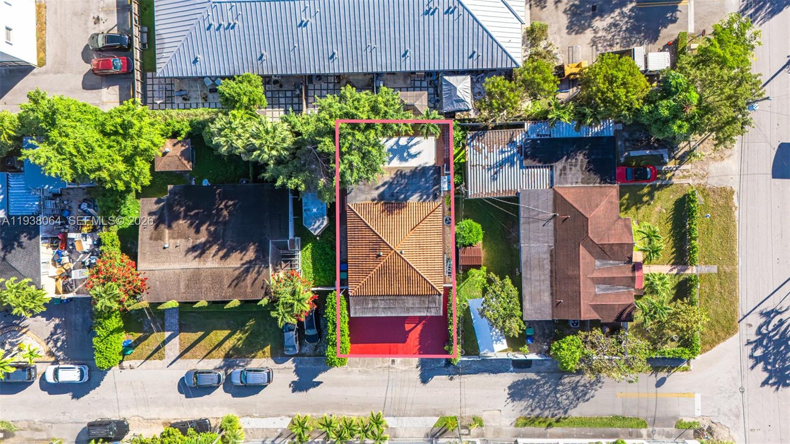 An aerial view shows a residential property with a tiled roof and a red driveway — 1937 SW 57th Ct, Miami FL 33155, MIAMI, FL