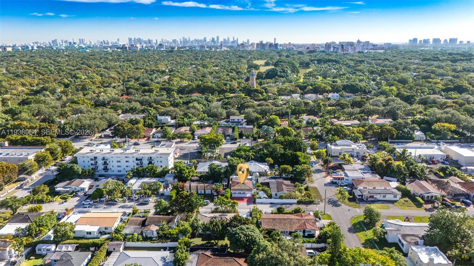 An aerial view shows a residential neighborhood with a marked house and a distant skyline — 1937 SW 57th Ct, Miami FL 33155, MIAMI, FL