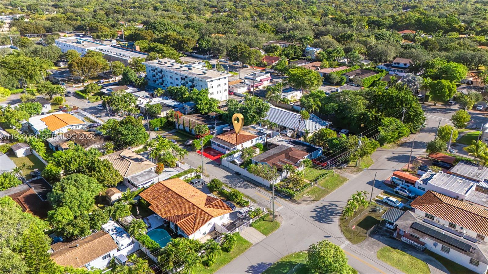 An aerial view shows a residential neighborhood with a highlighted house featuring a red roof — 1937 SW 57th Ct, Miami FL 33155, MIAMI, FL
