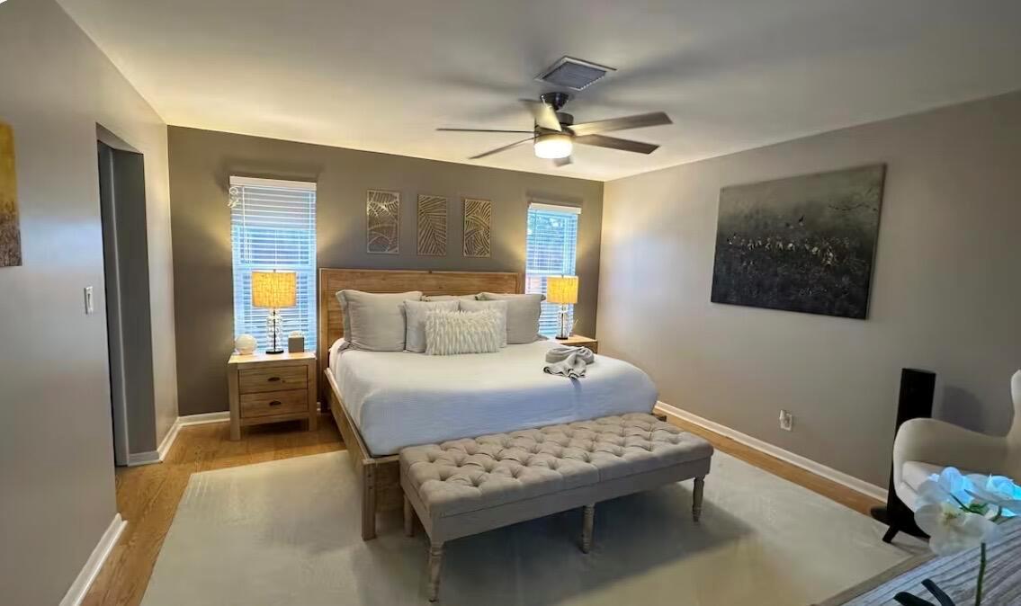A single-story house with a white garage, a paved driveway, and a landscaped palm tree garden — 528 Date Palm Drive, Lake Park FL 33403, LAKE PARK, FL