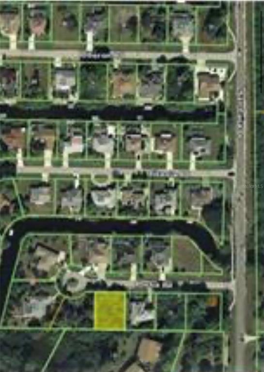 This is an aerial map showing a highlighted vacant residential lot in a suburban neighborhood — 2676 PORTIA ROAD, ENGLEWOOD, FL