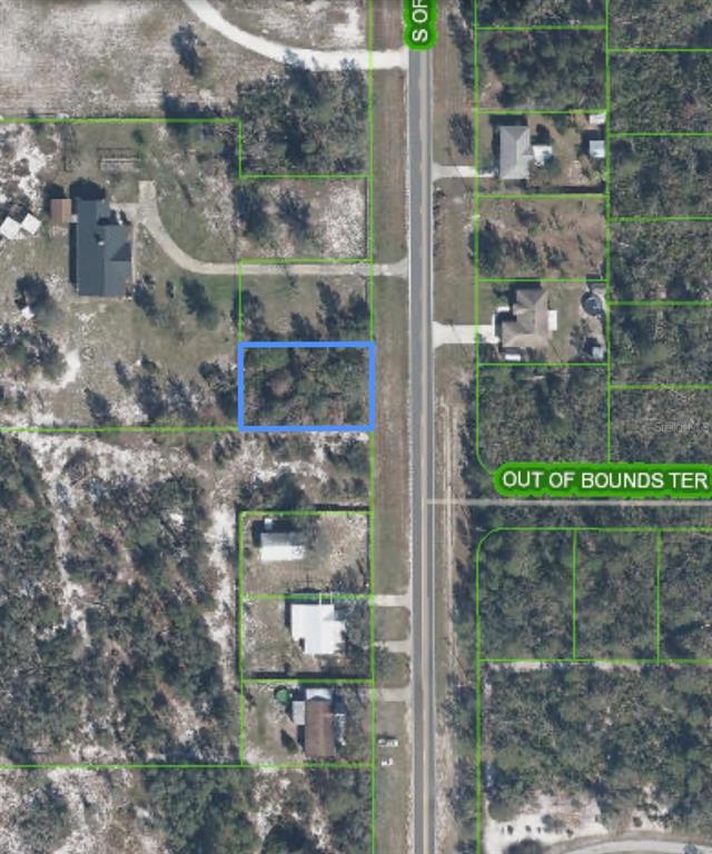 This aerial map shows a vacant, rectangular residential lot highlighted in blue along a road — 10657 S ORANGE BLOSSOM BOULEVARD, SEBRING, FL