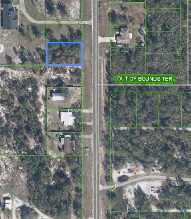 This is an aerial map view showing a vacant lot highlighted in blue along a road — 10657 S ORANGE BLOSSOM BOULEVARD, SEBRING, FL