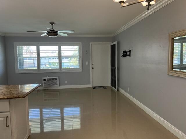 A room with light gray walls, tile flooring, a ceiling fan, and a window unit — 800 W Horizons W # 211, Boynton Beach FL 33435, BOYNTON BEACH, FL