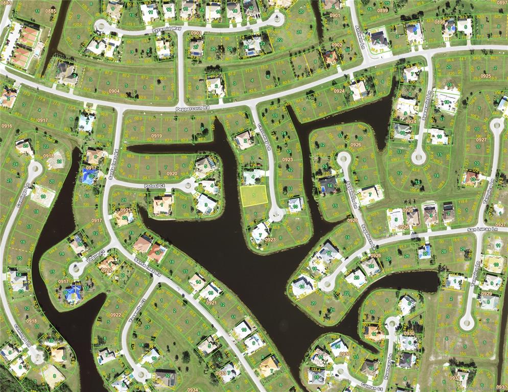 This is a satellite map view of a residential neighborhood with houses and waterways — 17283 CARROWAY LANE, PUNTA GORDA, FL