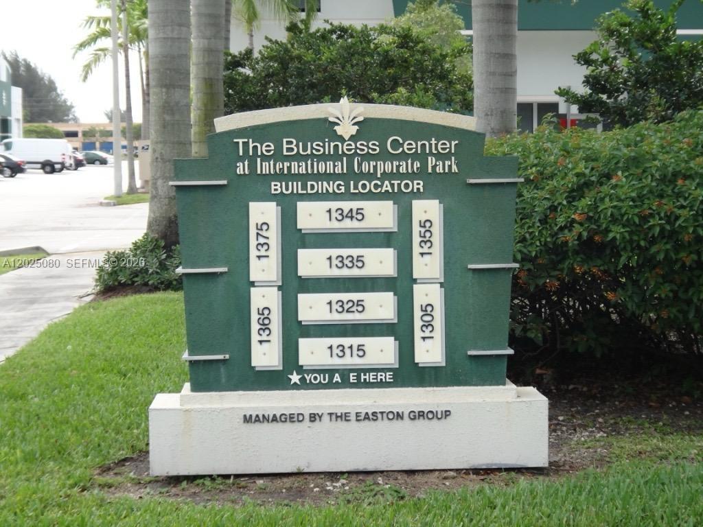 A green building locator sign stands on a lawn at International Corporate Park — 1365 NW 98th Ct # 5, Doral FL 33172, DORAL, FL