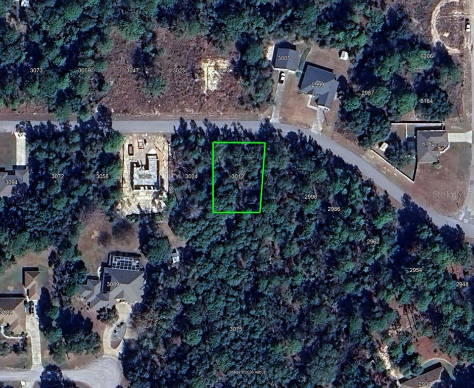 An aerial map view shows a vacant, wooded residential lot highlighted with a green border — 3012 W EUNICE DRIVE, DUNNELLON, FL