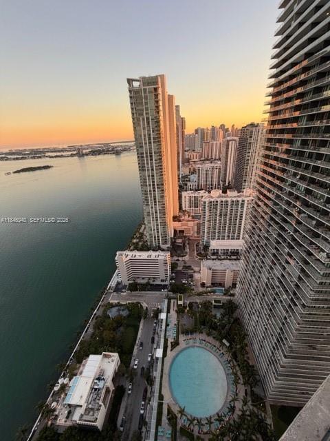 An elevated view of a coastal city skyline featuring high-rise buildings, a pool, and water — 650 NE 32nd St # 4406, Miami FL 33137, MIAMI, FL