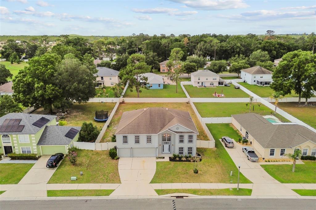 An aerial view of a two-story suburban house with a tan roof and gray siding — 4612 SE 31ST PLACE, OCALA, FL