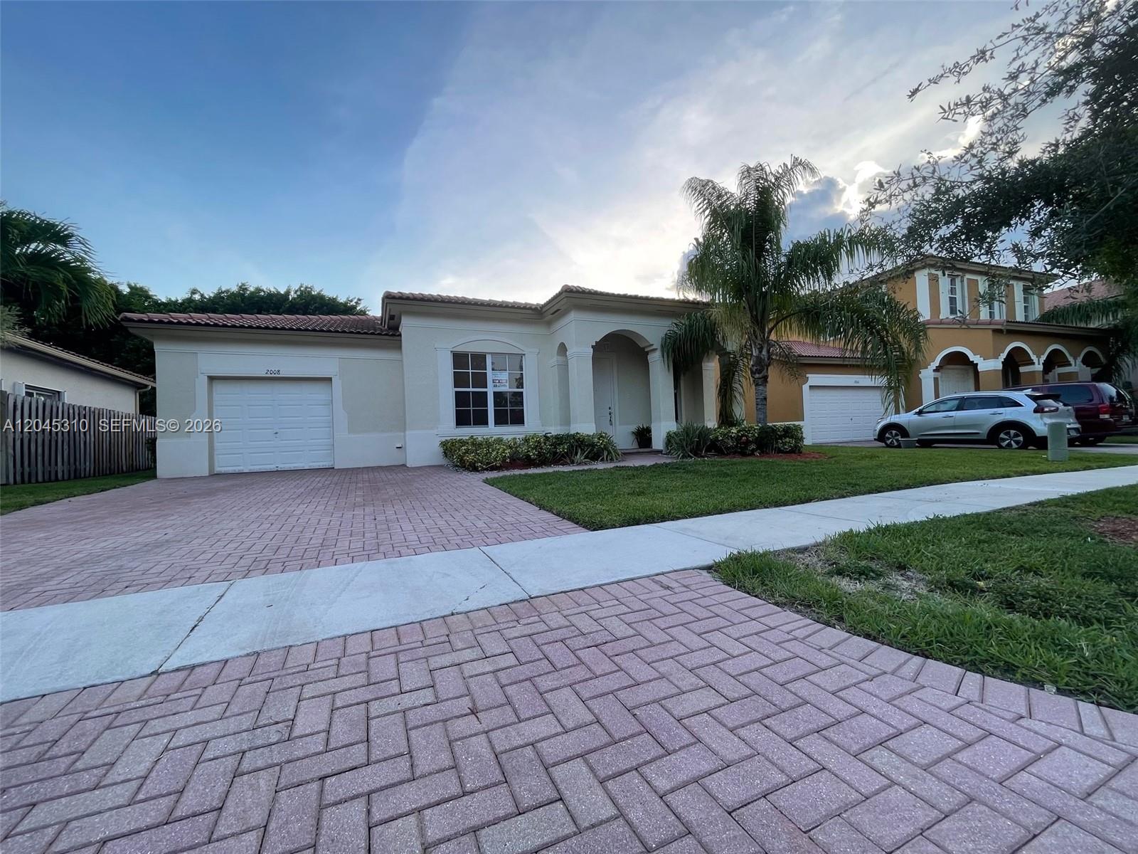 This image shows a digital list of names and a business entity on a screen — 2008 NE 38th Rd # 2008, Homestead FL 33033, HOMESTEAD, FL