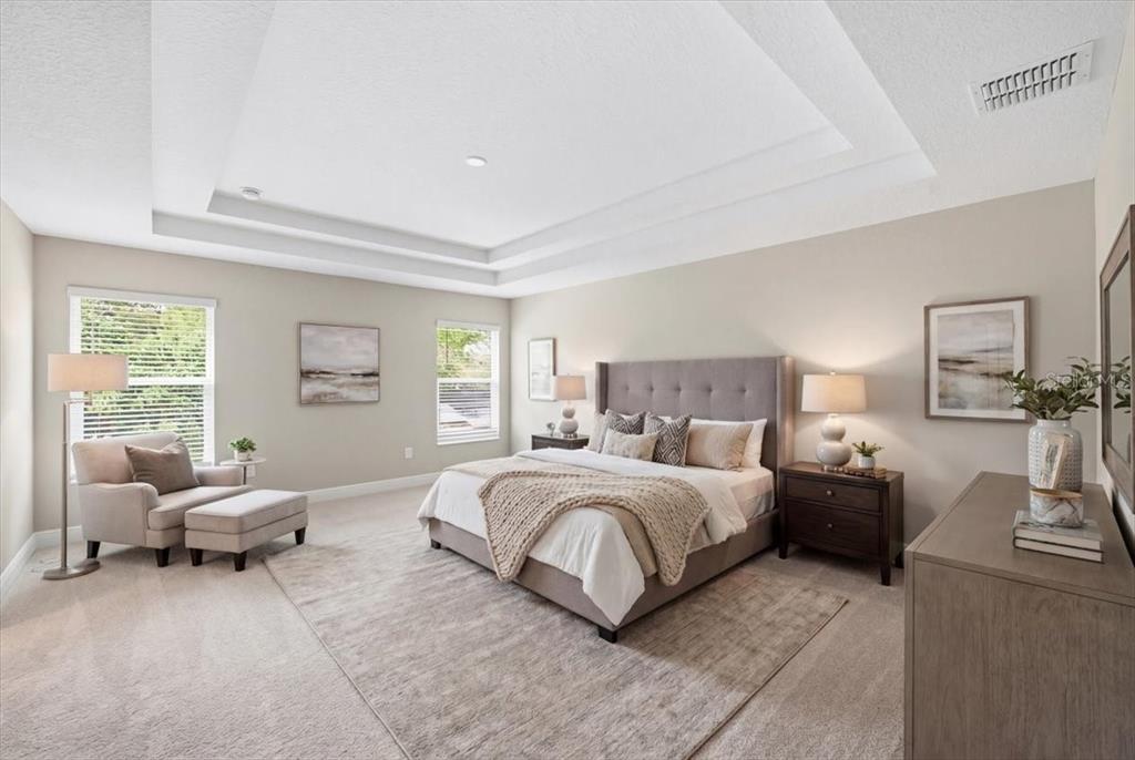 A bright, open-concept living room and kitchen area featuring neutral furniture and wood-look flooring — 6226 29TH STREET N, ST PETERSBURG, FL