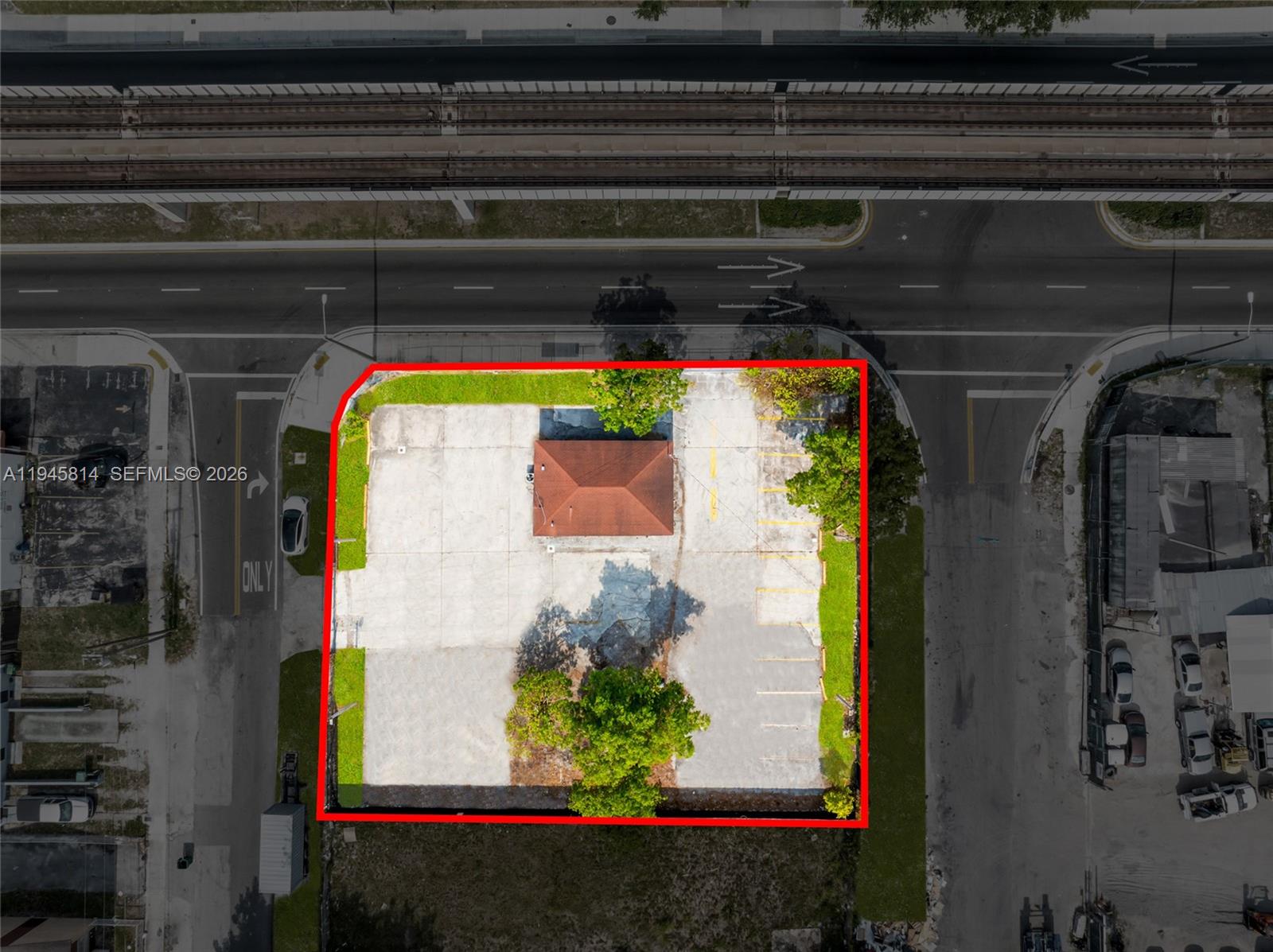An aerial view shows a small building with a brown roof on a paved lot — 6801 NW 27th Ave, Miami FL 33147, MIAMI, FL