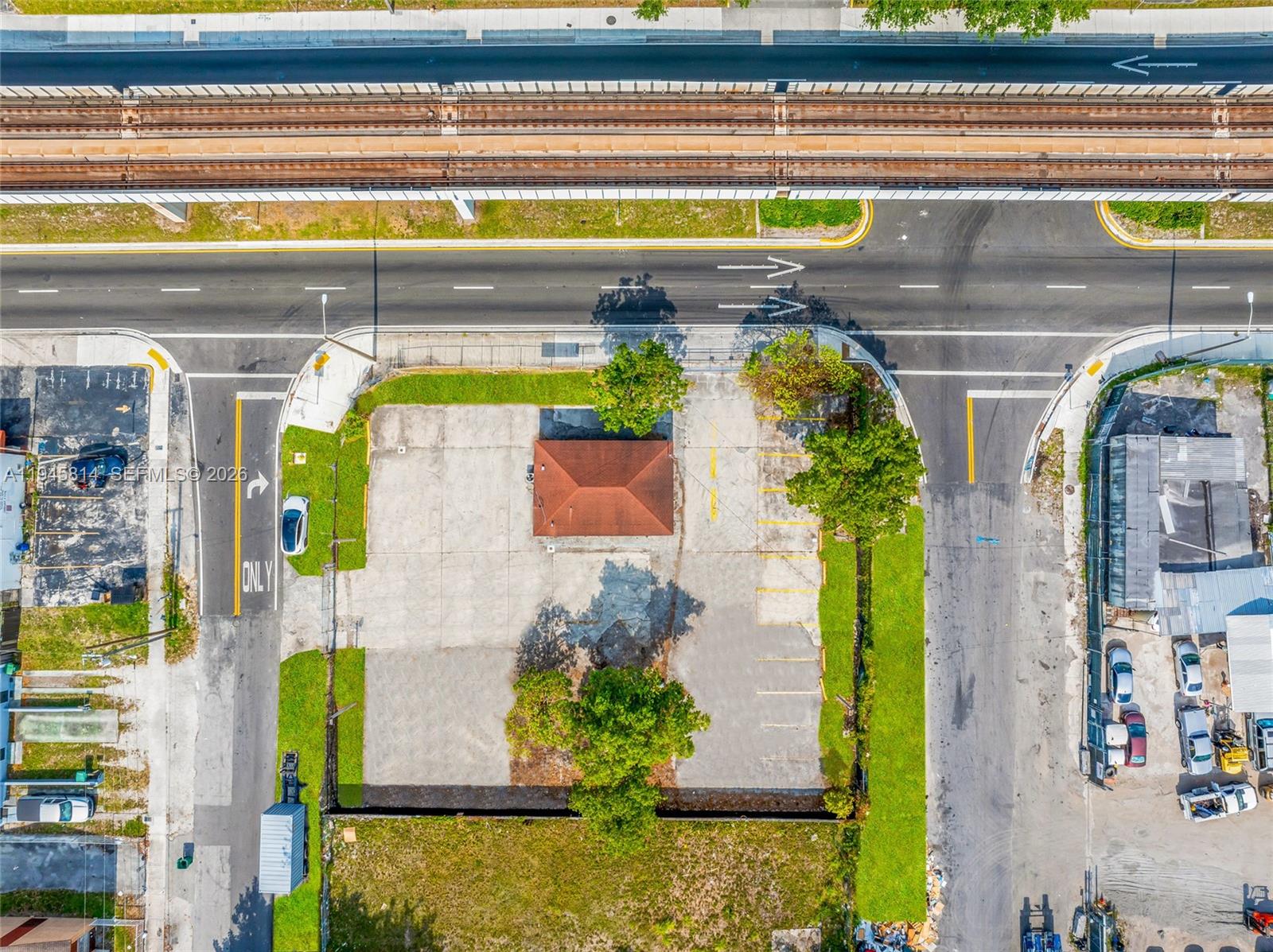 An aerial view shows a small building with a brown roof on a paved lot — 6801 NW 27th Ave, Miami FL 33147, MIAMI, FL