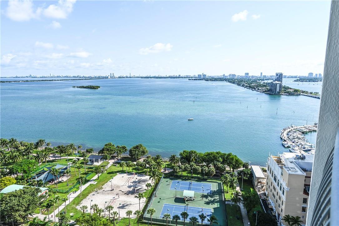 An elevated view of a bay, a park with tennis courts, and a marina — 1750 N Bayshore Drive # 2403, Miami FL 33132, MIAMI, FL