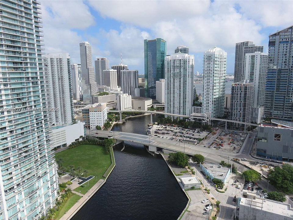 An elevated view of the Miami skyline featuring high-rise buildings, a river, and a bridge — 690 SW 1st Ct # 1908, Miami FL 33130, MIAMI, FL