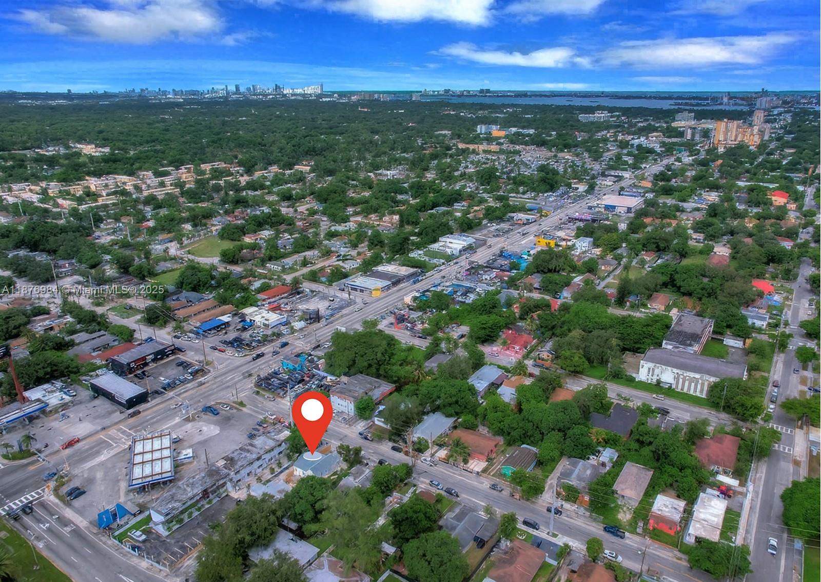 An aerial view shows a small house marked by a pin in a suburban neighborhood — 7814 NW 5th Ct, Miami FL 33150, MIAMI, FL