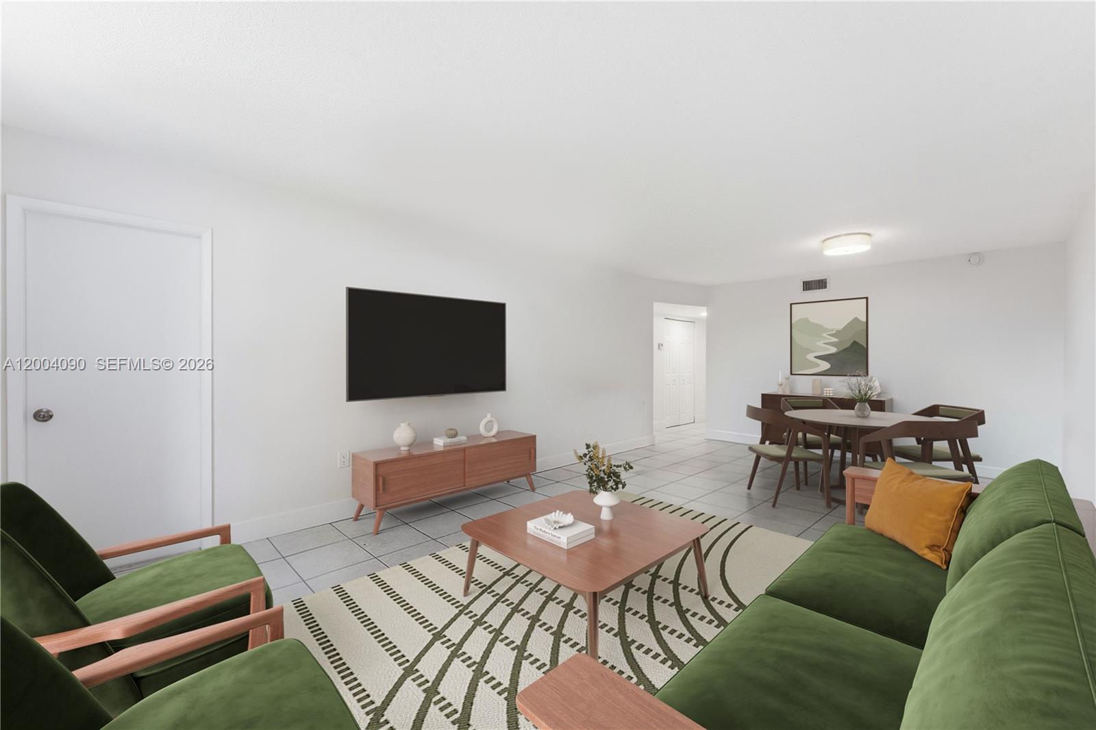 A swimming pool with a tiki hut sits on a lawn in front of apartments — 10852 N Kendall Dr # 312, Miami FL 33176, MIAMI, FL