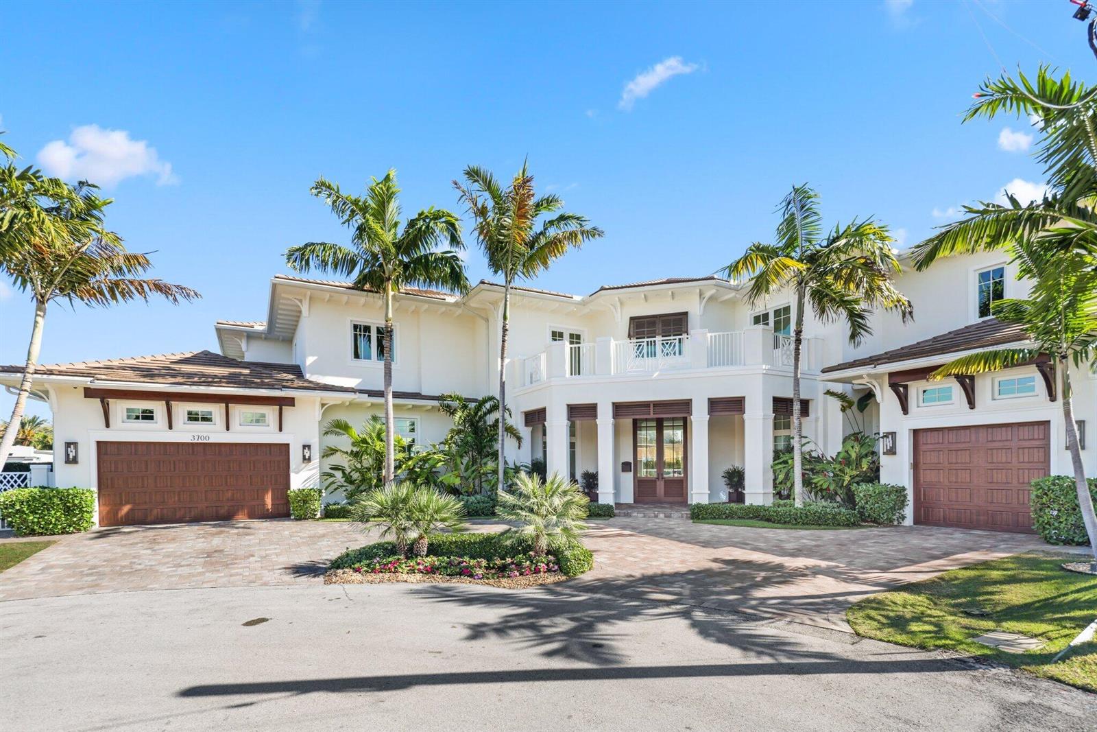A two-story white house with a multi-car garage, palm trees, and a paved driveway — 3700 NE 24th Avenue, Lighthouse Point FL 33064, LIGHTHOUSE POINT, FL
