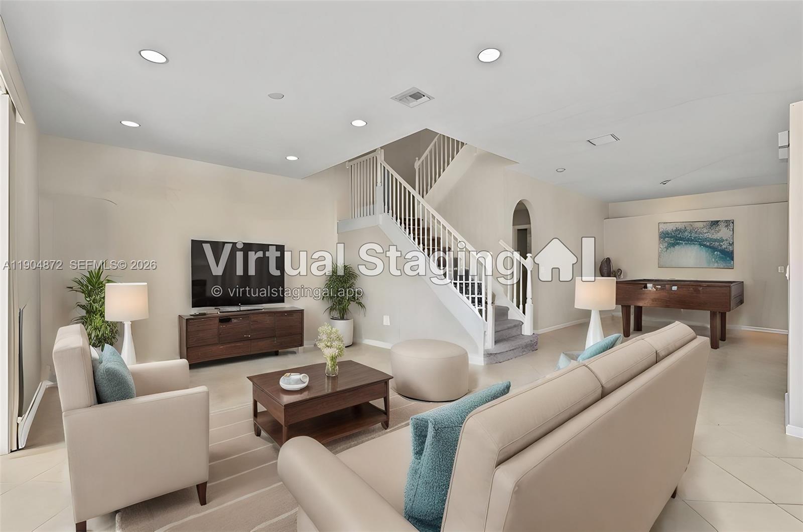 This living room features a staircase, a television, a sofa, and a pool table — 9042 Dupont Pl, Wellington FL 33414, WELLINGTON, FL