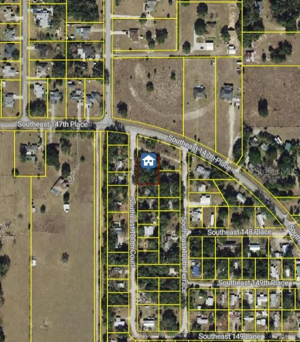This is an aerial map showing a highlighted residential lot located between two streets — TBD SE 100 COURT, SUMMERFIELD, FL
