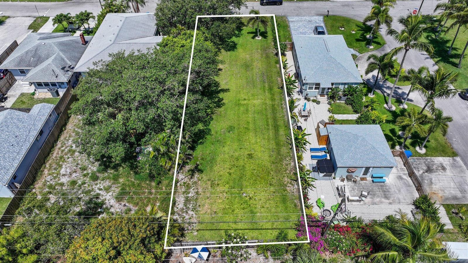 An aerial view shows a rectangular vacant lot bordered by residential houses and palm trees — 614 N 5th Street, Lantana FL 33462, LANTANA, FL