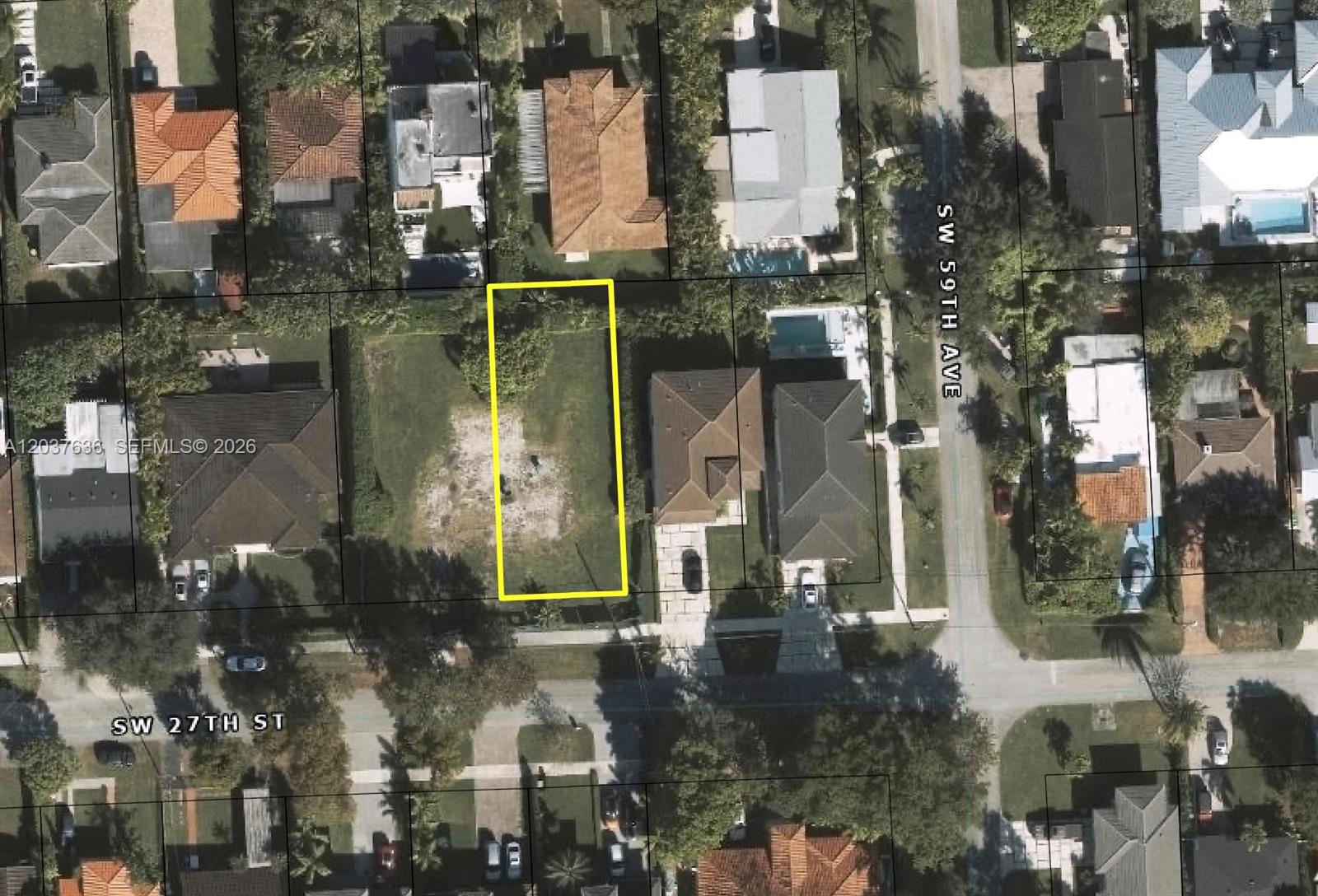 This aerial view shows a vacant, rectangular residential lot outlined in yellow — 5921 SW 27 st, Miami FL 33155, MIAMI, FL