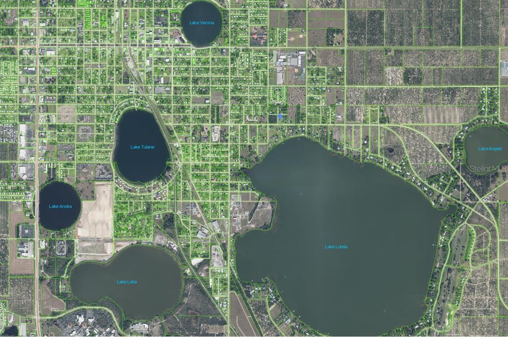 An aerial map view shows several lakes surrounded by residential streets and wooded areas — 611 S WILLOW AVENUE, AVON PARK, FL