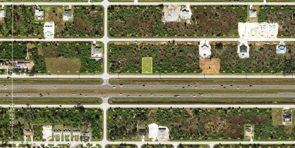 This is an aerial map showing a vacant rectangular lot highlighted in yellow — 12148 N ACCESS ROAD, PORT CHARLOTTE, FL