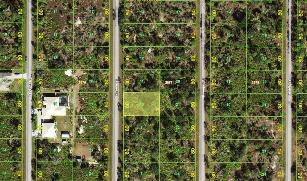 This is an aerial map showing residential lots and streets in a wooded area — 2308 KUEHLER STREET, PORT CHARLOTTE, FL
