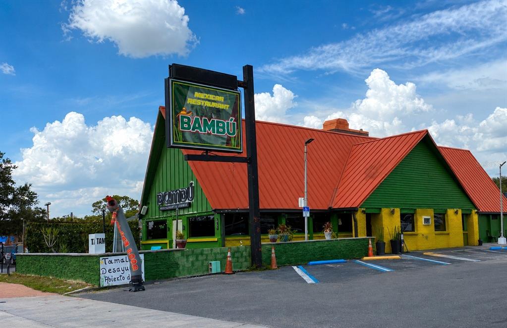 A Mexican restaurant with a green and yellow exterior and a bright orange metal roof — 5731 S. ORANGE BLOSSOM TRAIL, ORLANDO, FL