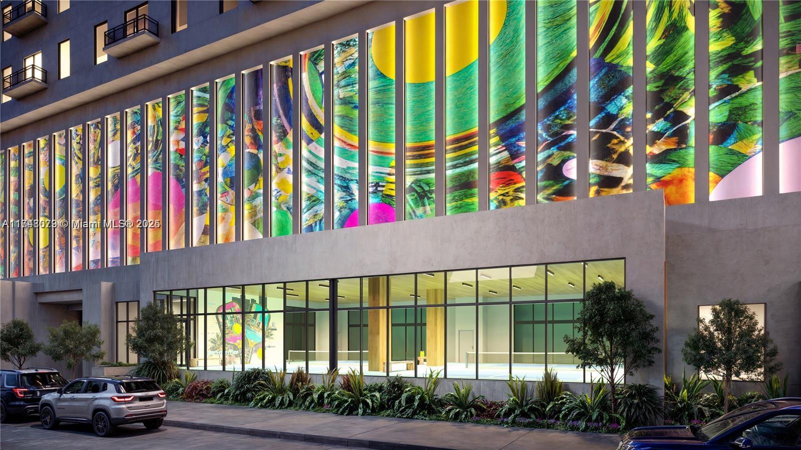 This architectural rendering shows a building exterior with colorful vertical panels above a glass-walled gym — 1420 NW 14th Ave # 312, Miami FL 33125, MIAMI, FL
