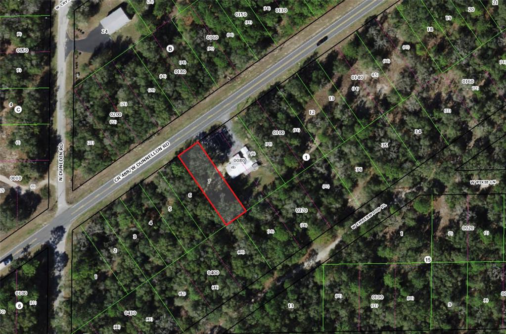 This is an aerial map showing a rectangular property parcel outlined in red — 7652 W DUNNELLON ROAD, DUNNELLON, FL