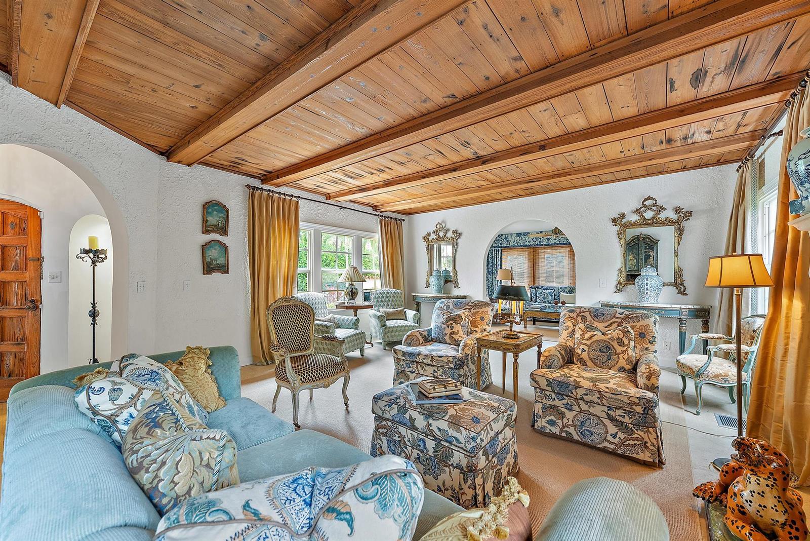 A living room features a wood-beamed ceiling, white textured walls, and patterned upholstered furniture — 325 Seaspray Avenue, Palm Beach FL 33480, PALM BEACH, FL