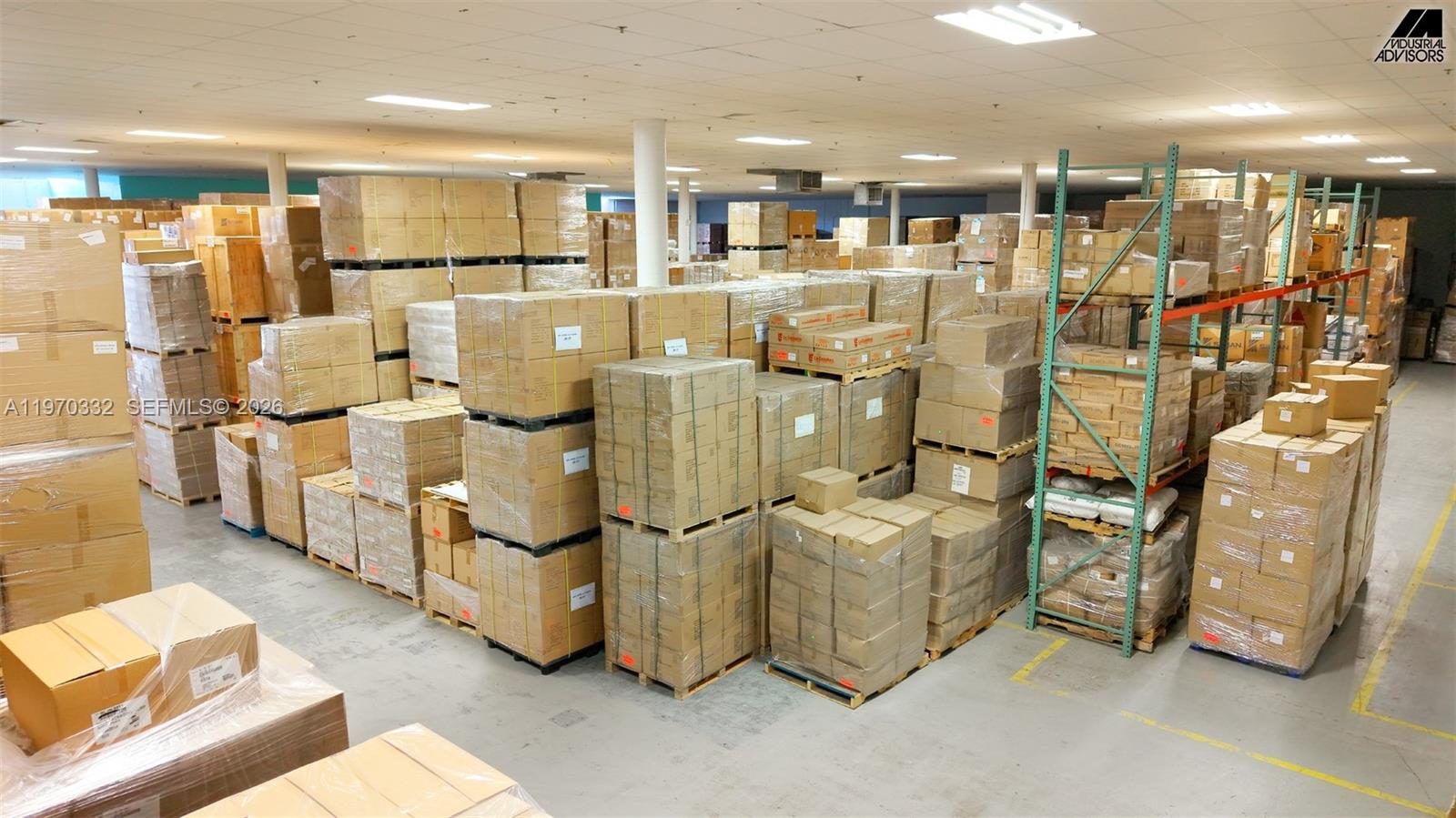 A large warehouse interior is filled with numerous stacks of cardboard boxes on pallets — 5800 E Miami Lakes Dr E, Miami Lakes FL 33014, MIAMI LAKES, FL