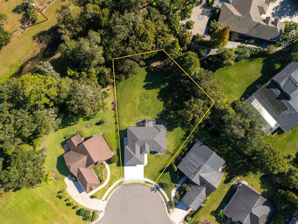 An aerial view shows a house on a cul-de-sac lot with a large backyard — 3160 OAKPARK DRIVE, LAKELAND, FL