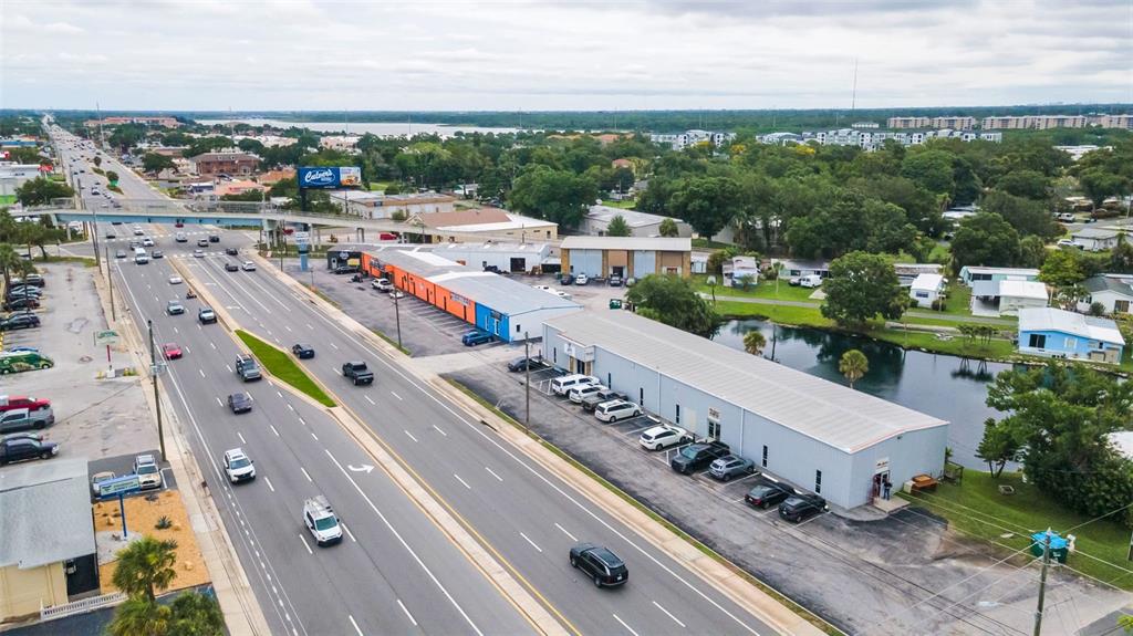 An aerial view shows a commercial building with a parking lot next to a highway — 6581 SEMINOLE BOULEVARD, SEMINOLE, FL