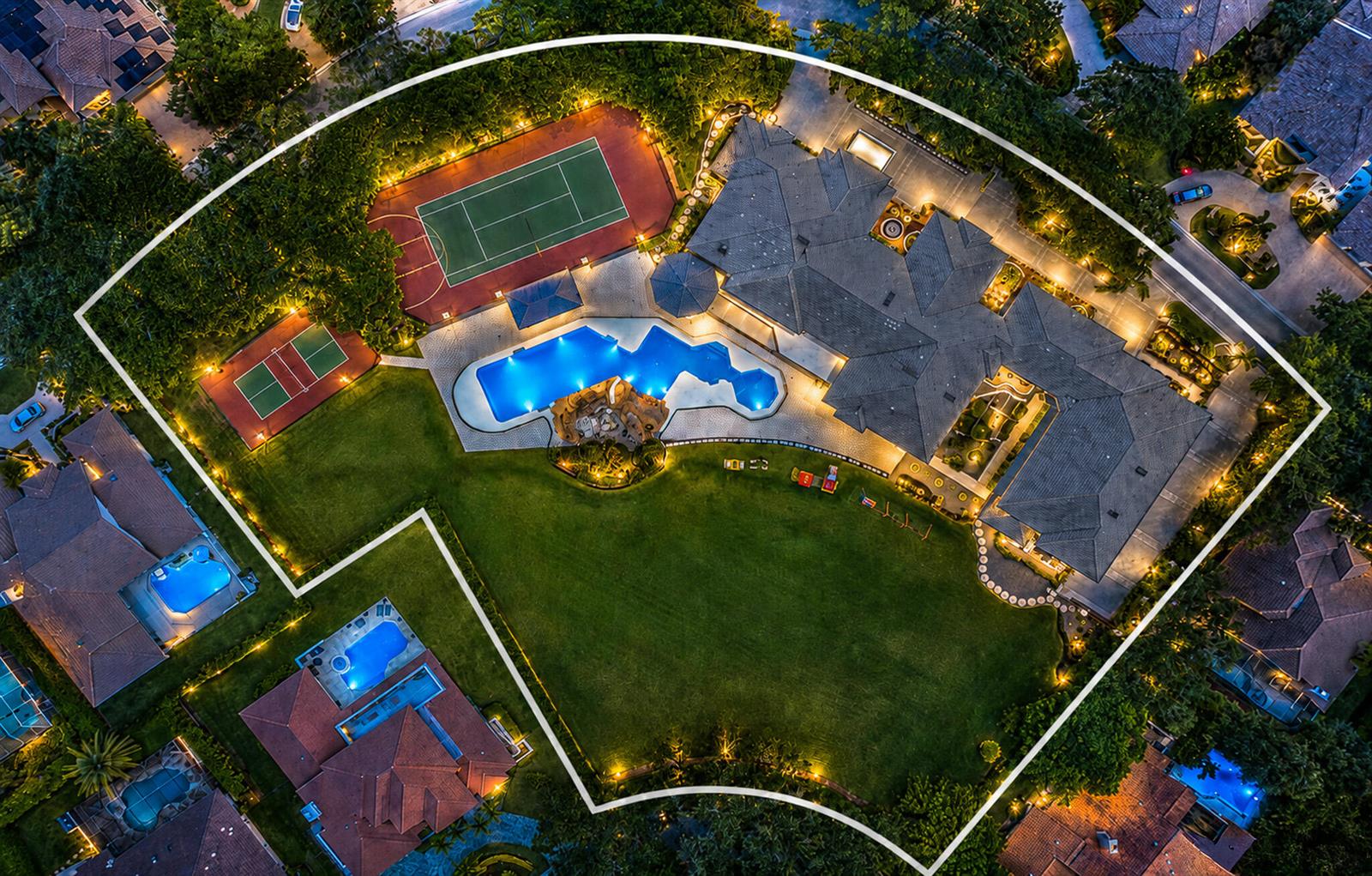 An aerial view of a luxury estate featuring a large house, pool, and tennis courts — 1800 Eagle Trace Boulevard, Coral Springs FL 33071, CORAL SPRINGS, FL