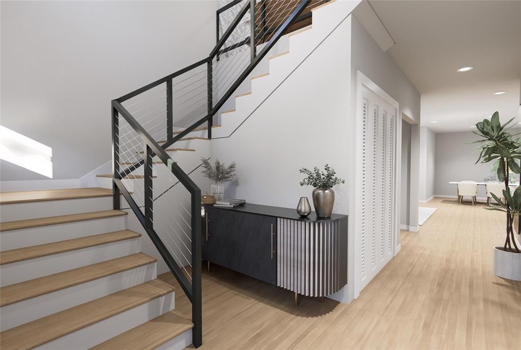 A rendering of a modern staircase with cable railings next to a contemporary console table — 6805 S ELEMETA STREET, TAMPA, FL