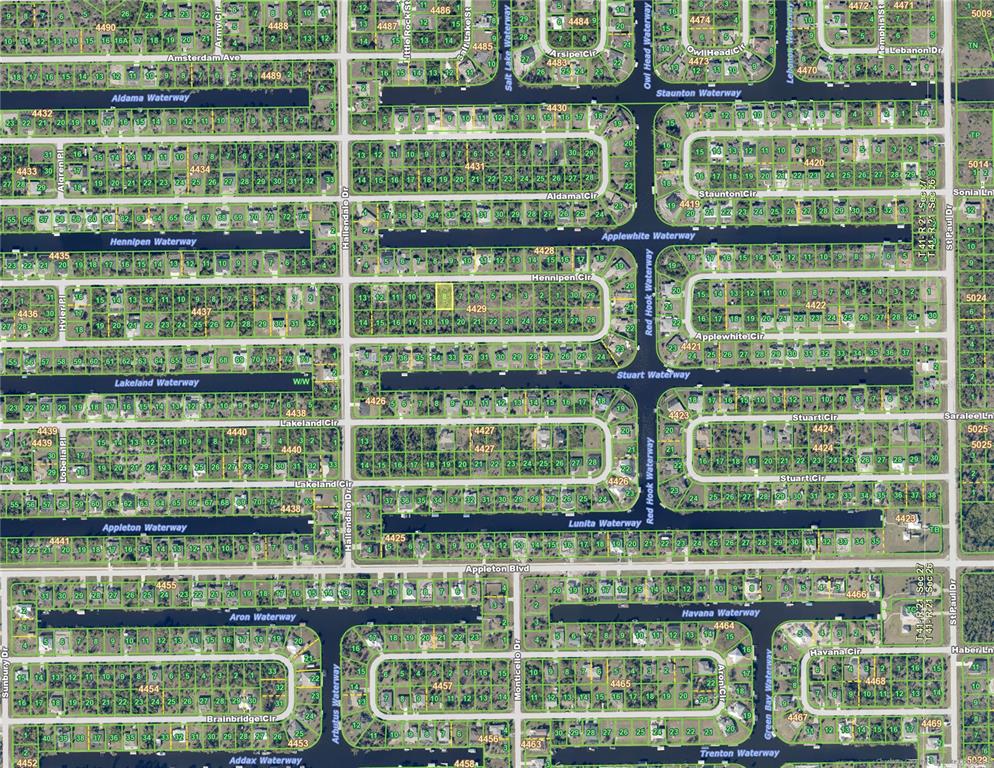 This is a satellite map view of a residential neighborhood with houses and waterways — 15809 HENNIPEN CIRCLE, PORT CHARLOTTE, FL